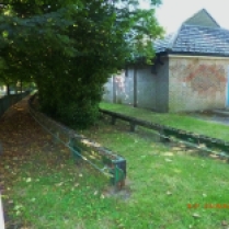View south to the loop area with the topiary 'locomotive' and the electrical sub-station. The school proposes to take the building here and all the grounds behind it down to the sub-station